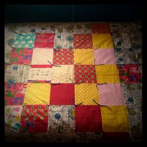Contemporary handmade patchwork crib quilt.